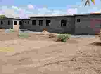 Current building rear view showing roof structure, Divine Health Community Health Centre in Shinyanga
